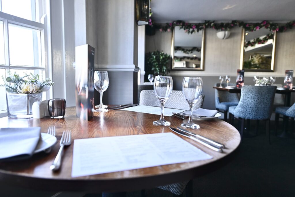 Table set for customers in the Quayside Restaurant, Brixham